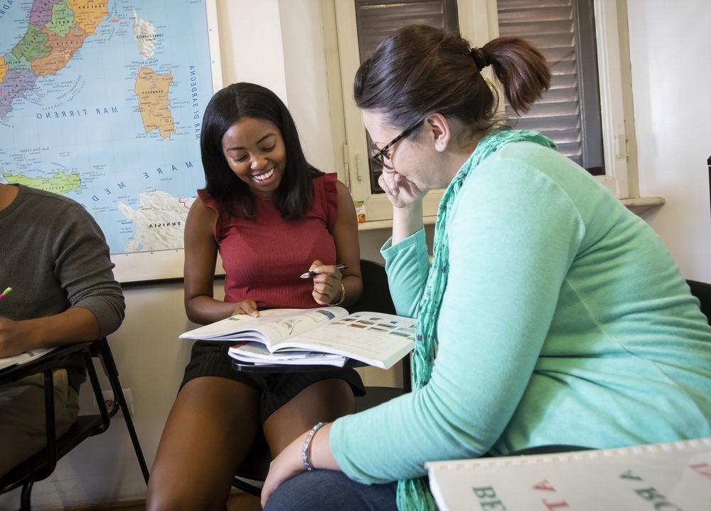 Two students engaging in a foreign language class at Temple University.